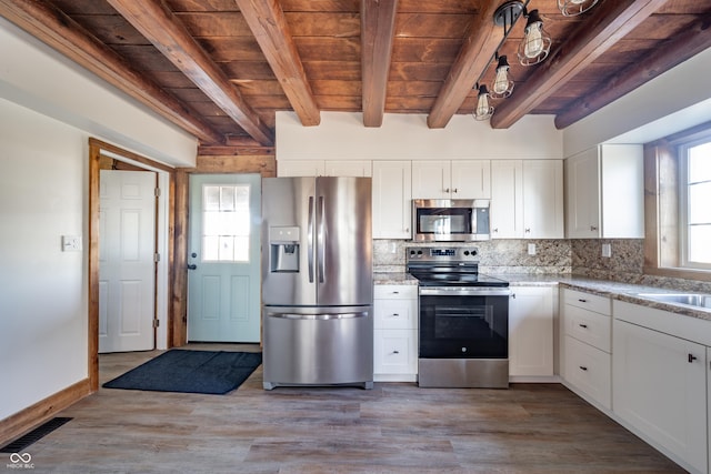 kitchen featuring wooden ceiling, light hardwood / wood-style flooring, backsplash, white cabinets, and appliances with stainless steel finishes