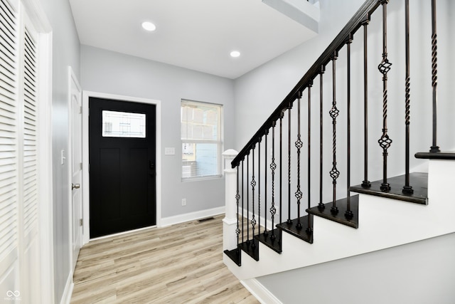 foyer entrance with light wood-type flooring