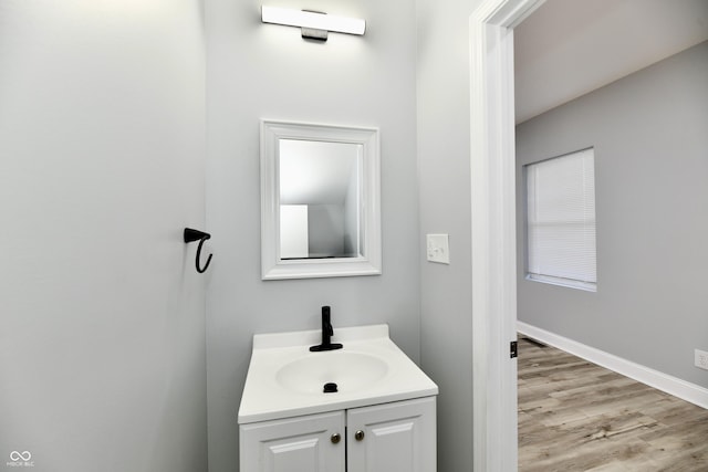 bathroom featuring hardwood / wood-style floors and vanity