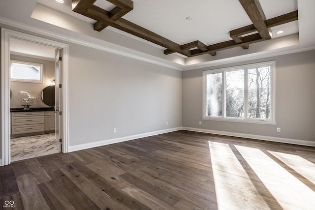 spare room with dark hardwood / wood-style floors, plenty of natural light, and coffered ceiling