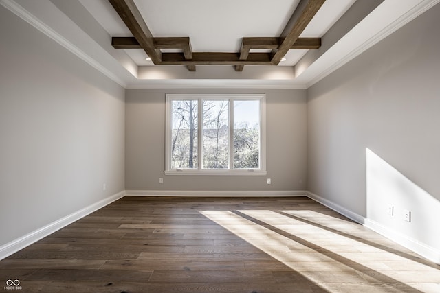 spare room featuring beamed ceiling, ornamental molding, and hardwood / wood-style flooring