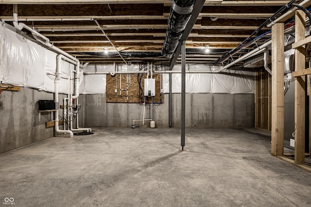 basement featuring tankless water heater