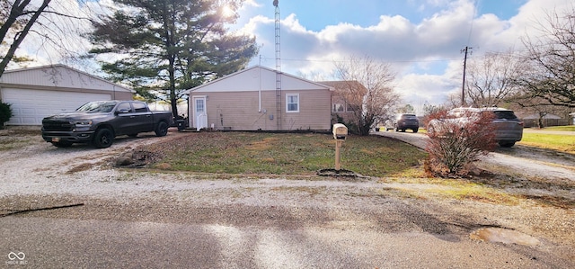 view of side of home with an outbuilding and a garage