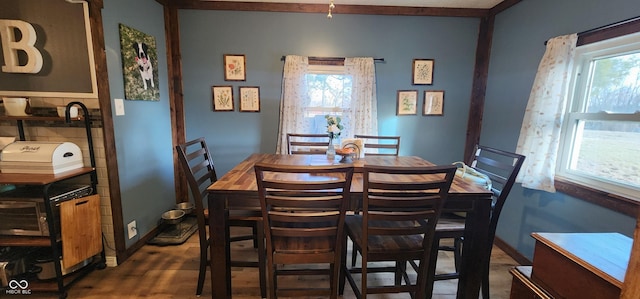 dining space featuring dark hardwood / wood-style flooring