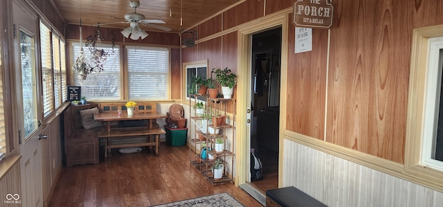 sunroom / solarium with wooden ceiling and ceiling fan