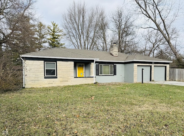 ranch-style house featuring a front lawn and a garage