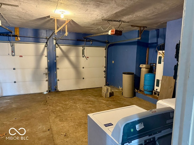 garage featuring a garage door opener and washer / dryer