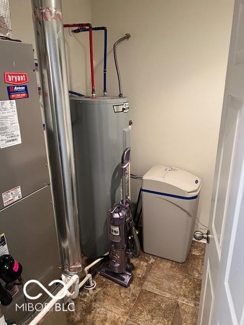 utility room featuring water heater