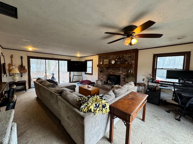 living room with a wealth of natural light, carpet floors, and a textured ceiling