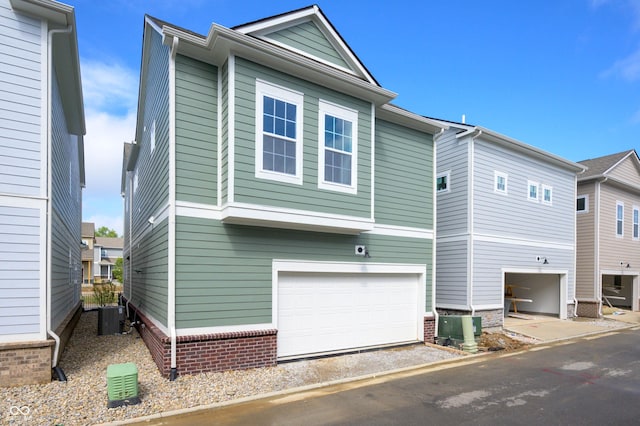 exterior space featuring a garage and central air condition unit