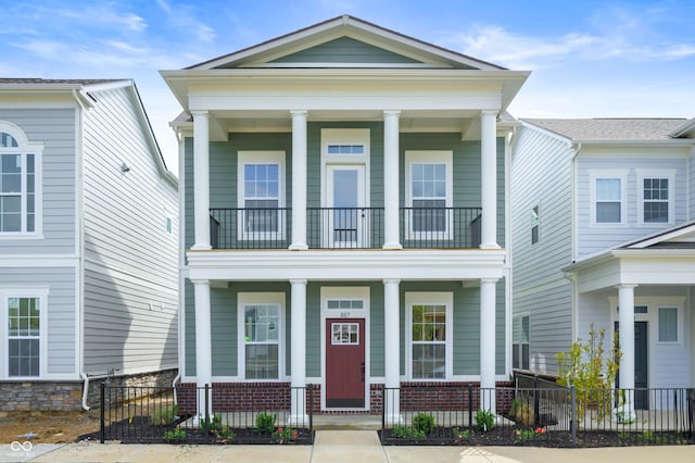 neoclassical / greek revival house with a porch and a balcony