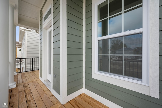 wooden terrace featuring covered porch