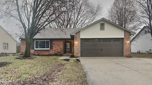 ranch-style home featuring a garage and a front lawn