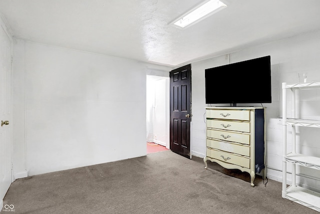 unfurnished bedroom with carpet flooring and a textured ceiling