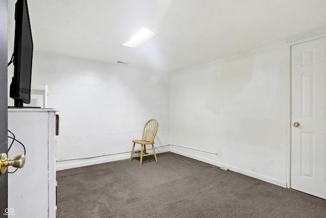 empty room featuring dark carpet