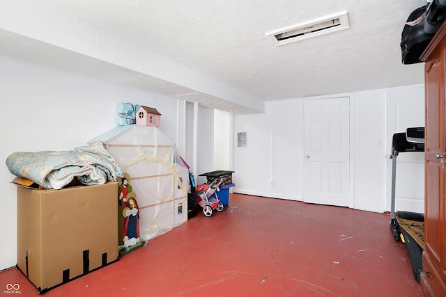 interior space featuring a textured ceiling