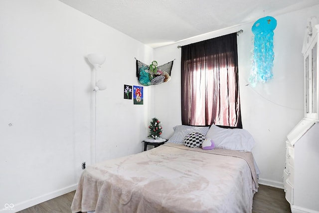 bedroom with hardwood / wood-style flooring