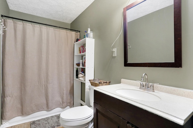 full bathroom featuring vanity, a textured ceiling, toilet, and shower / bath combo with shower curtain