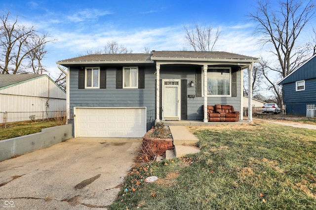 view of front of home featuring a garage and a front lawn