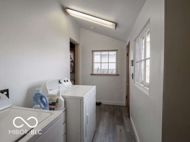 laundry area with separate washer and dryer and dark hardwood / wood-style floors