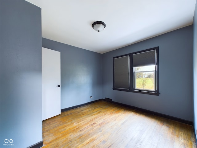 empty room with light hardwood / wood-style floors