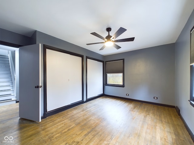 unfurnished bedroom with hardwood / wood-style flooring and ceiling fan