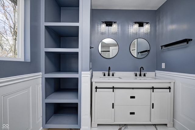 bathroom featuring plenty of natural light, built in features, and vanity