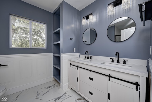 bathroom with built in features and vanity