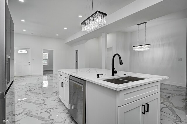 kitchen with a center island with sink, stainless steel dishwasher, white cabinetry, and sink