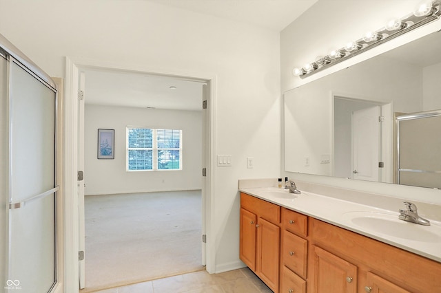 bathroom featuring vanity, tile patterned floors, and an enclosed shower