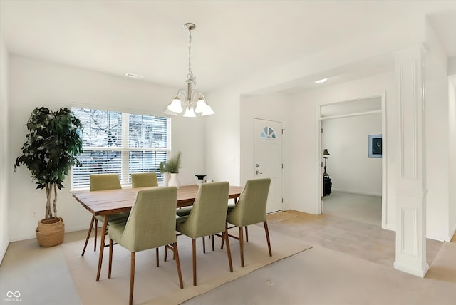 dining space featuring a chandelier