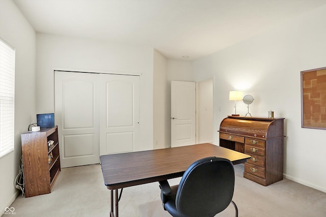 office space with light colored carpet