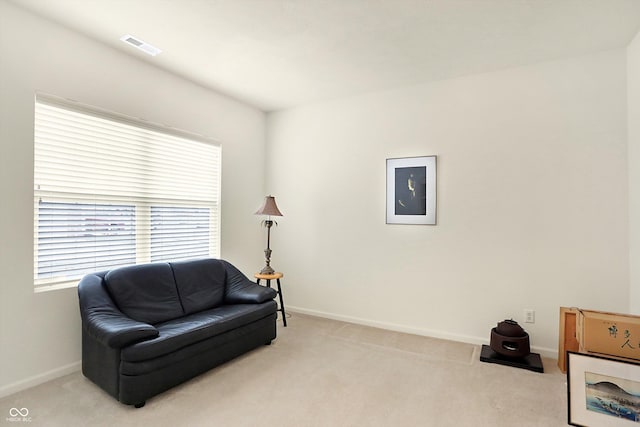 sitting room with light colored carpet