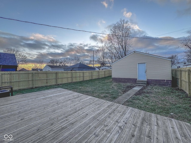 deck at dusk with a lawn