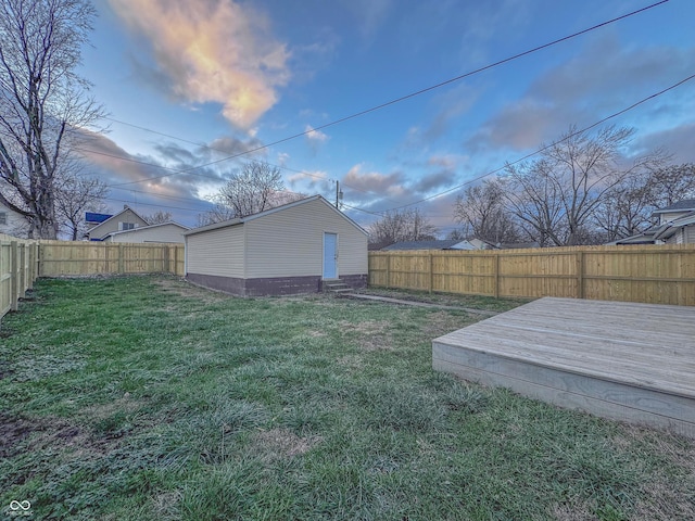 yard at dusk with a wooden deck