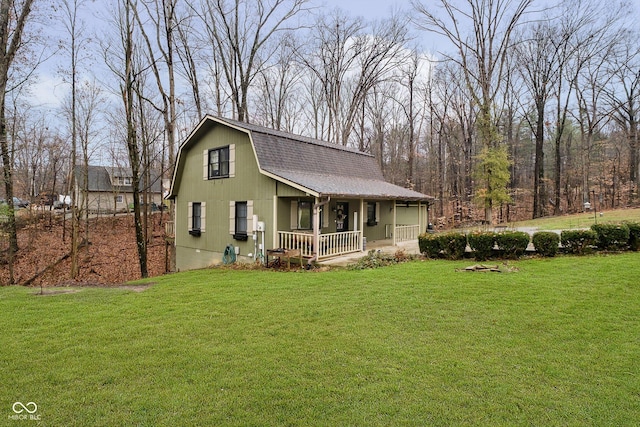 exterior space with covered porch and a front yard