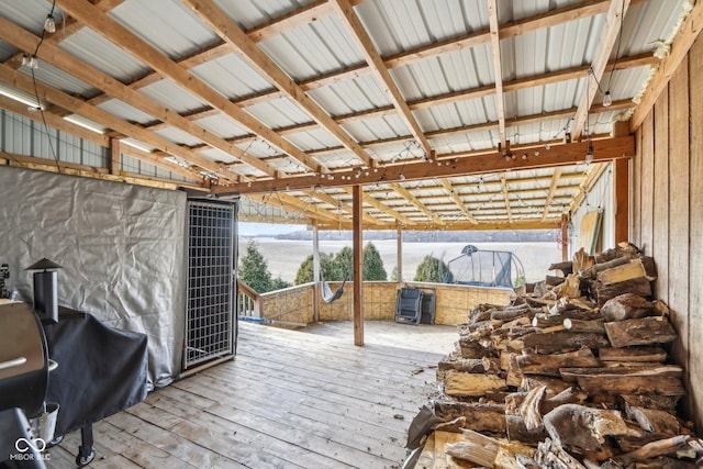 wooden terrace featuring a grill