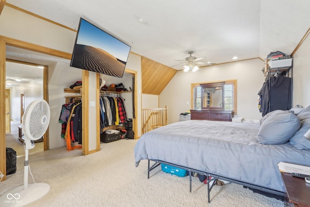 carpeted bedroom with vaulted ceiling and a closet