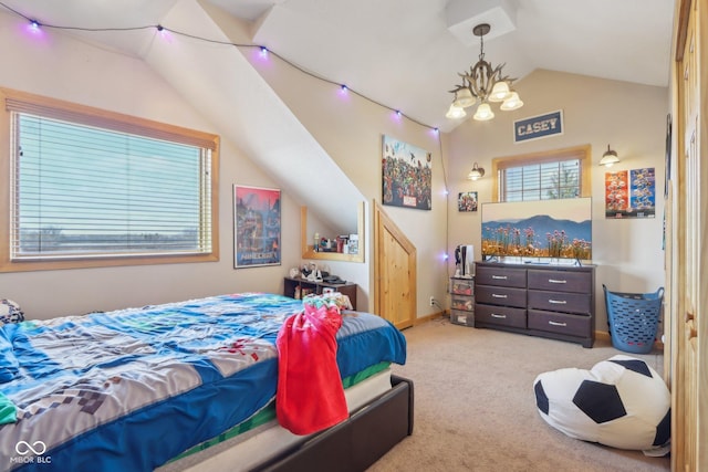 bedroom with a notable chandelier, lofted ceiling, and carpet