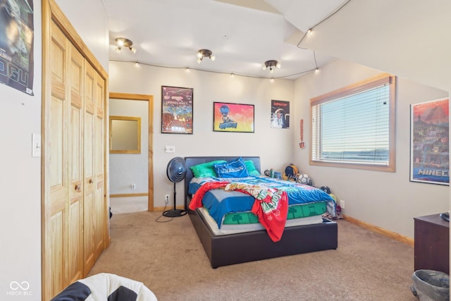 bedroom featuring light carpet