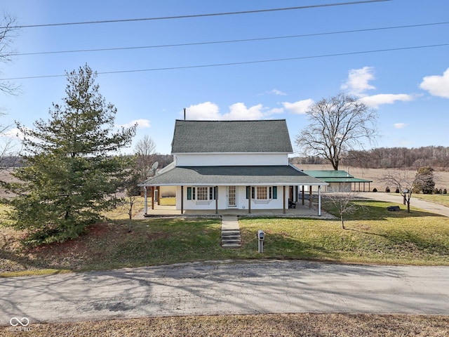 farmhouse inspired home with covered porch and a front lawn