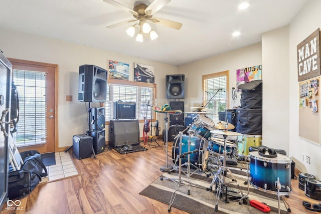 interior space featuring wood-type flooring and ceiling fan