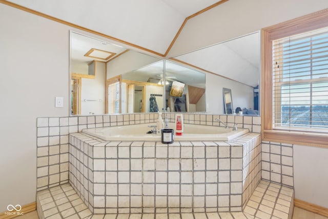 bathroom featuring ceiling fan and vaulted ceiling