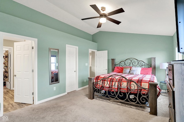 carpeted bedroom with lofted ceiling and ceiling fan