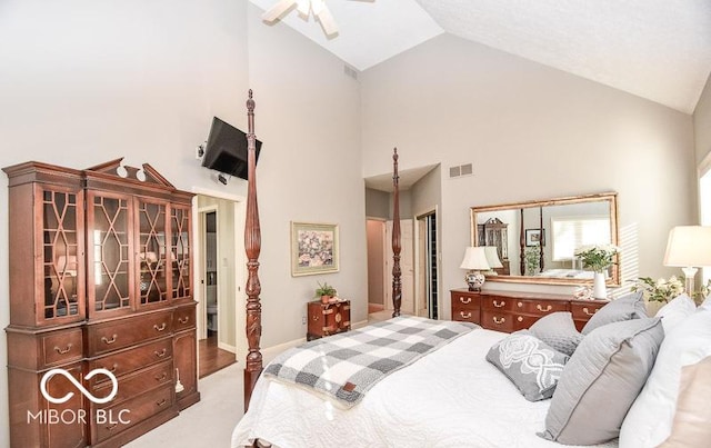 bedroom with ceiling fan, a closet, and high vaulted ceiling