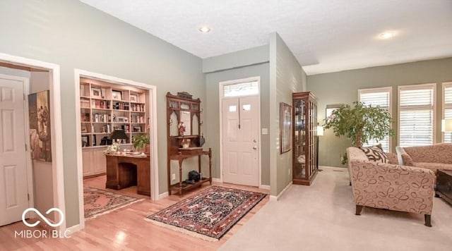 entryway with light hardwood / wood-style flooring