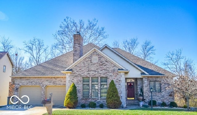 view of front of house with a garage and a front lawn