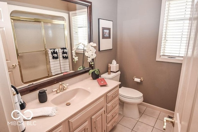 bathroom featuring tile patterned flooring, vanity, and toilet