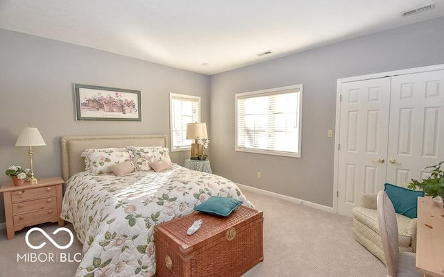 carpeted bedroom featuring a closet