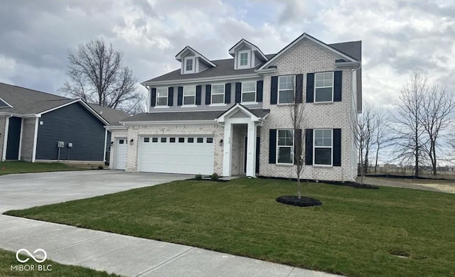 view of front of home featuring a front yard and a garage